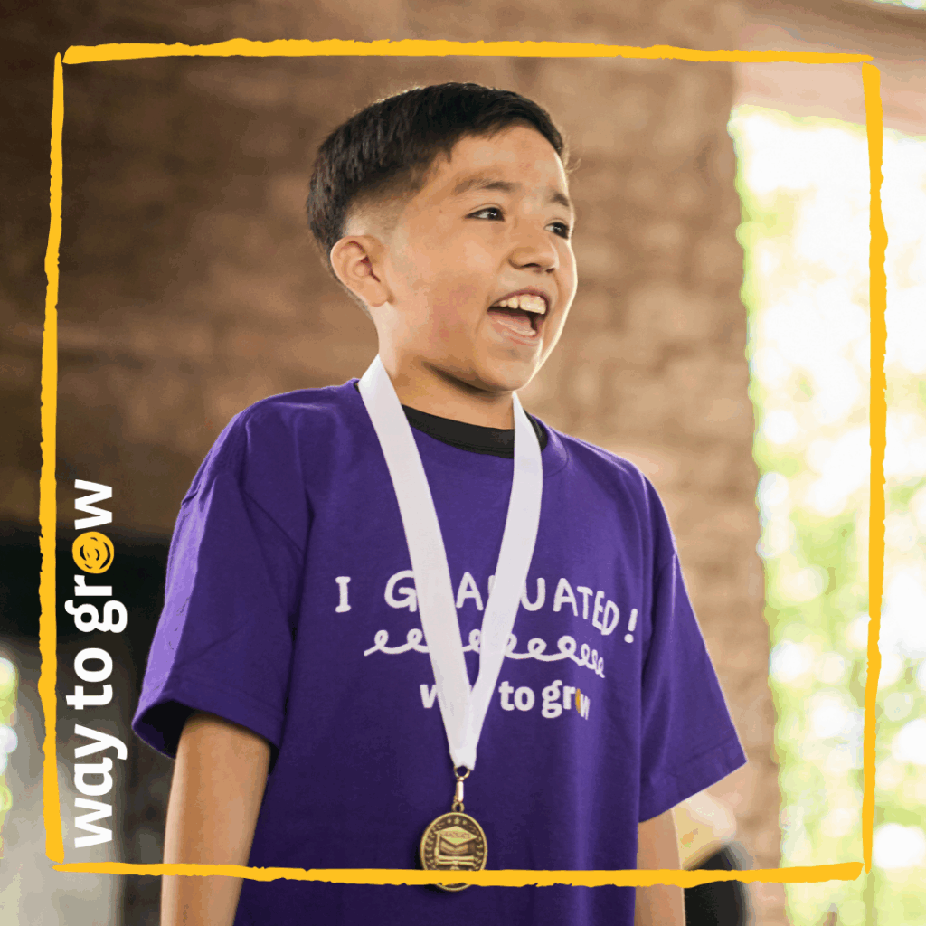 A very proud Way to Grow 3rd Grade Graduate with his medal