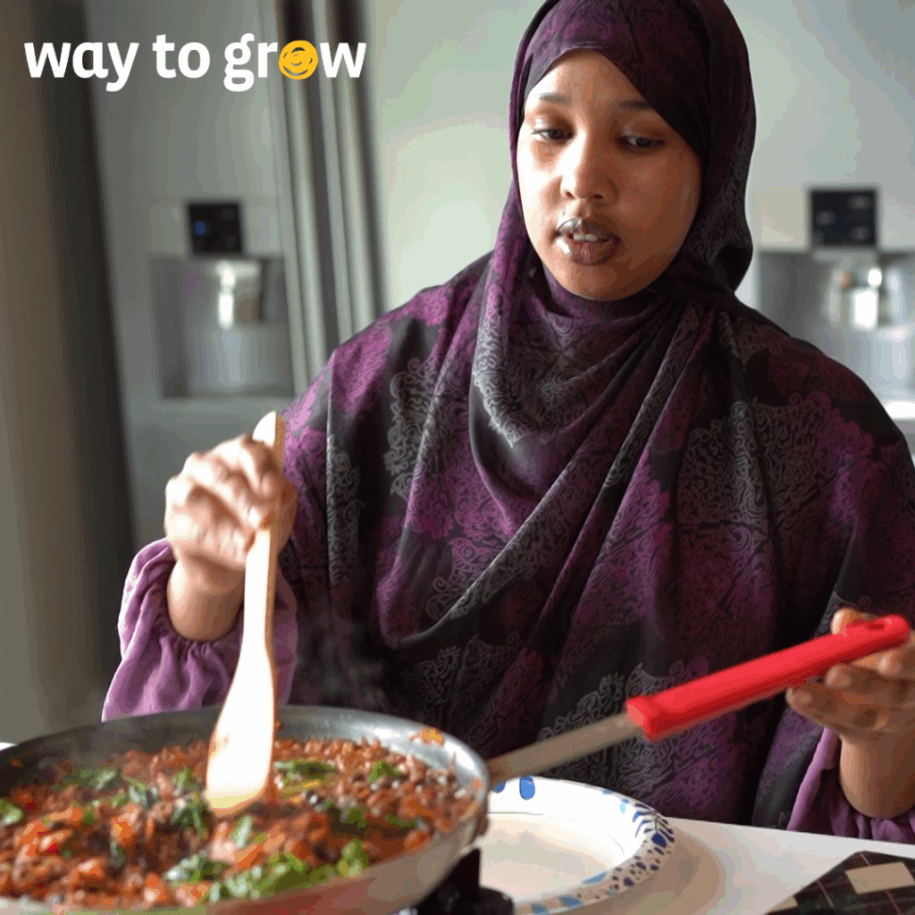 Parent cooking a new recipe during Cooking Matters session