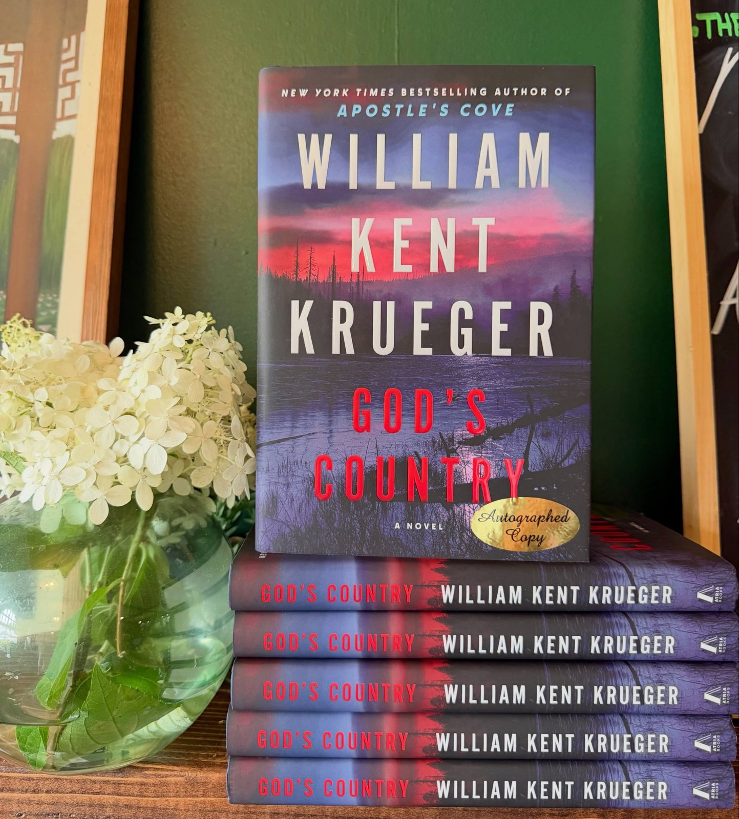 A stack of autographed copies of God’s Country by William Kent Krueger