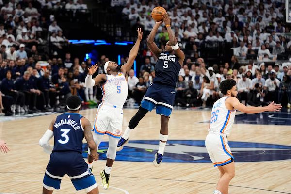 A Timberwolves player rises for a jump shot at Target Center
