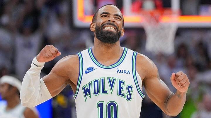A Timberwolves player in jersey #10 celebrating