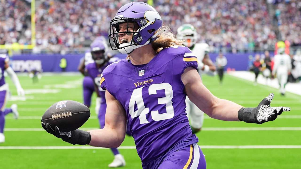 A Vikings player in jersey #43 celebrates with the football
